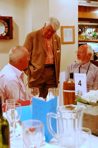 Gordon  talks to old members, iuncluding Founder President John Grover (right)